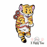 Tied-Up Baby Tiger Enamel Pin