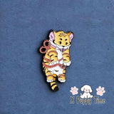 Tied-Up Baby Tiger Enamel Pin