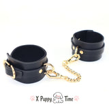 Black Leather Cuffs with Gold Chain